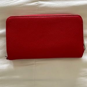 Like new, Thirty One wallet.  Red, silver zipper